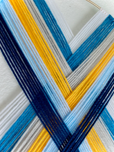 Load image into Gallery viewer, “Elevate” macramé heart weave wall hanging 💙💛🤍