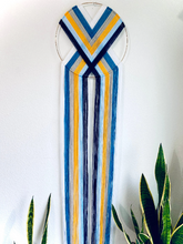 Load image into Gallery viewer, “Elevate” macramé heart weave wall hanging 💙💛🤍